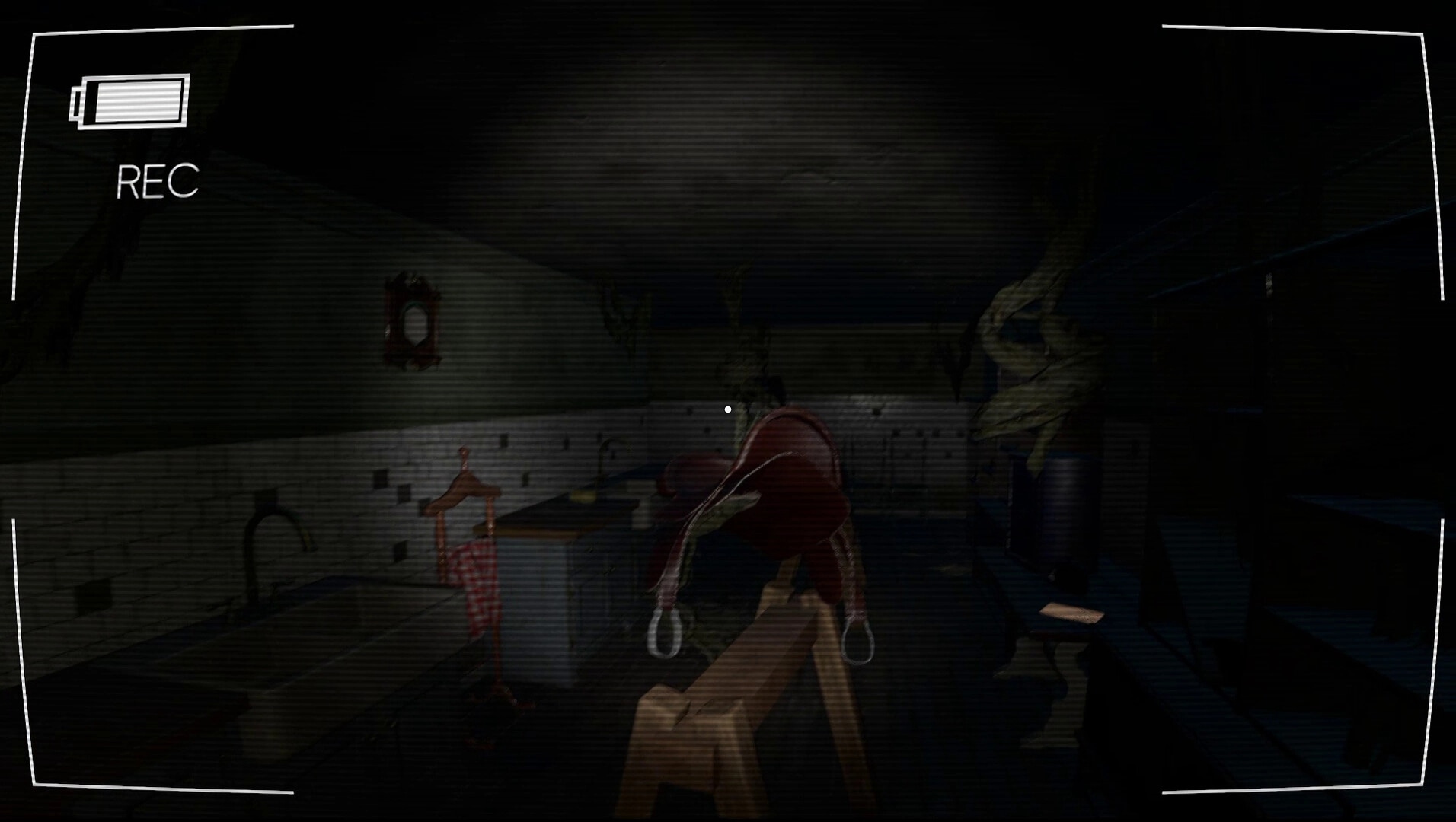 Vicious Cycle: Dark, eerie room with a camera HUD, saddle on a stand, and twisted tree roots inside.