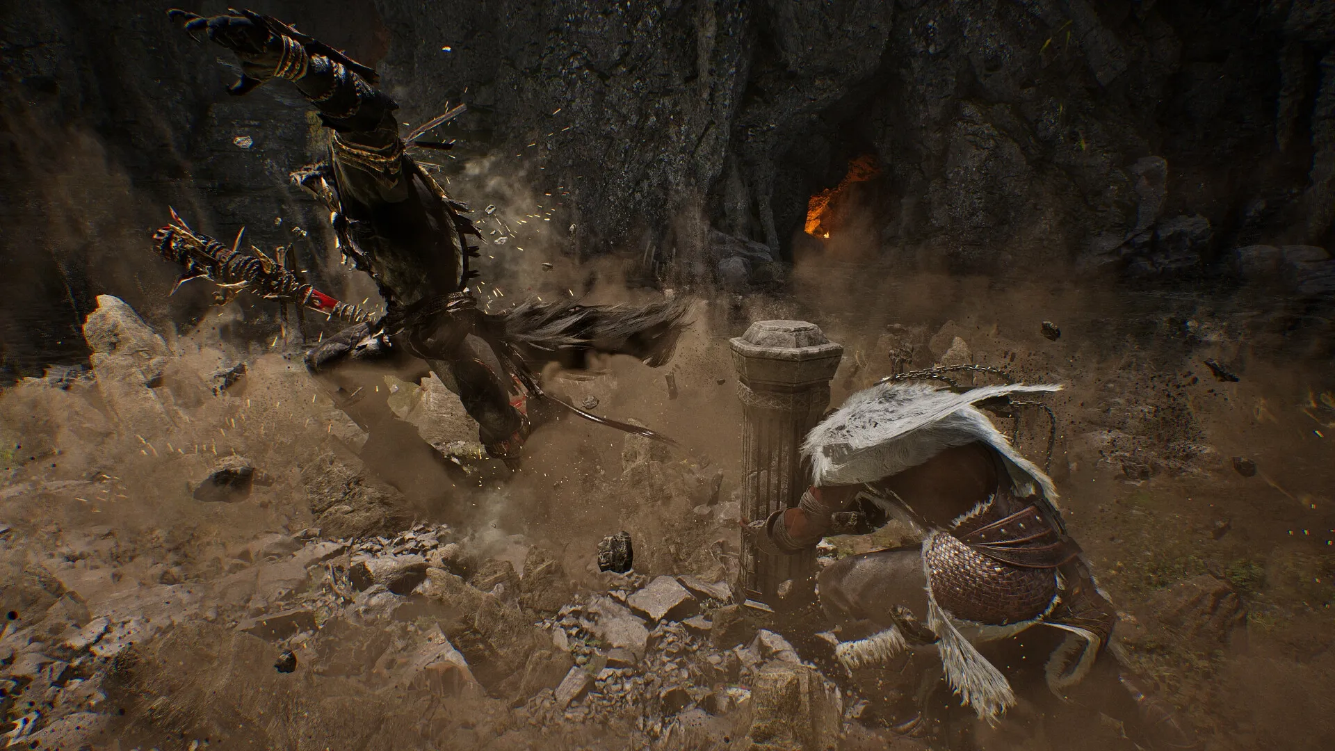 Vindictus: Intense combat with warrior and creature clashing in a rocky cave environment, dust flying around.