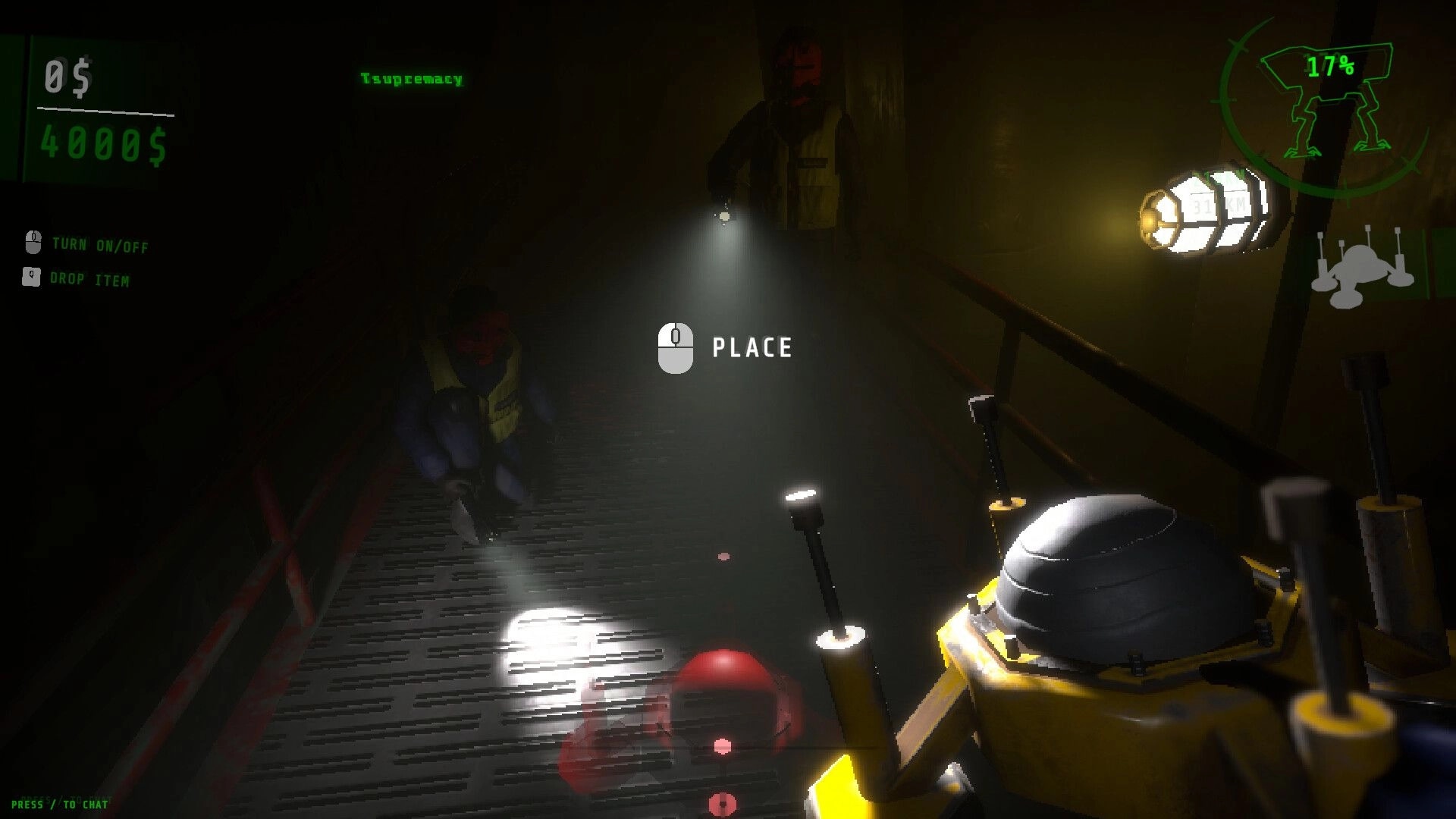 WALKER: Crew members explore dimly lit corridor with flashlights, readying equipment for monster hunt.