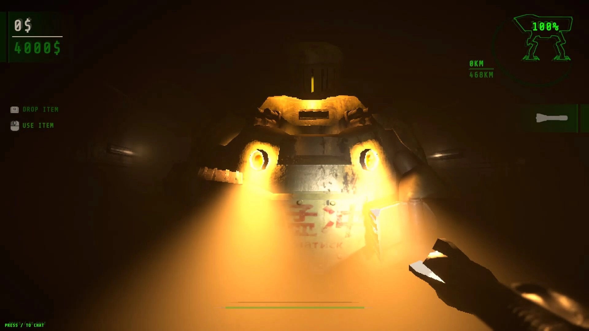 WALKER: Player with flashlight approaches massive armored walker in dimly lit environment, UI elements visible.