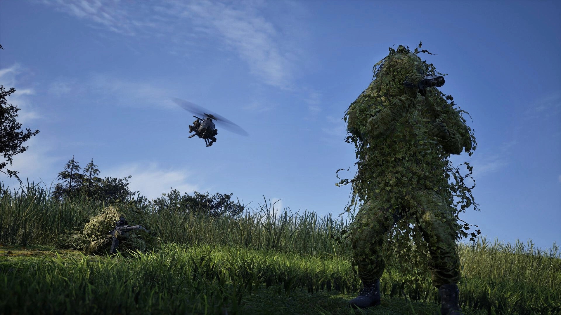 WARDOGS: Ghillie-suited soldiers aiming rifles as a helicopter hovers over a grassy hillside.
