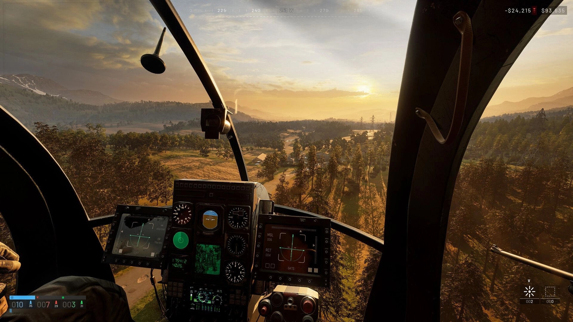 WARDOGS: Helicopter cockpit HUD with radar and targeting screens flying over forested valley at sunset.
