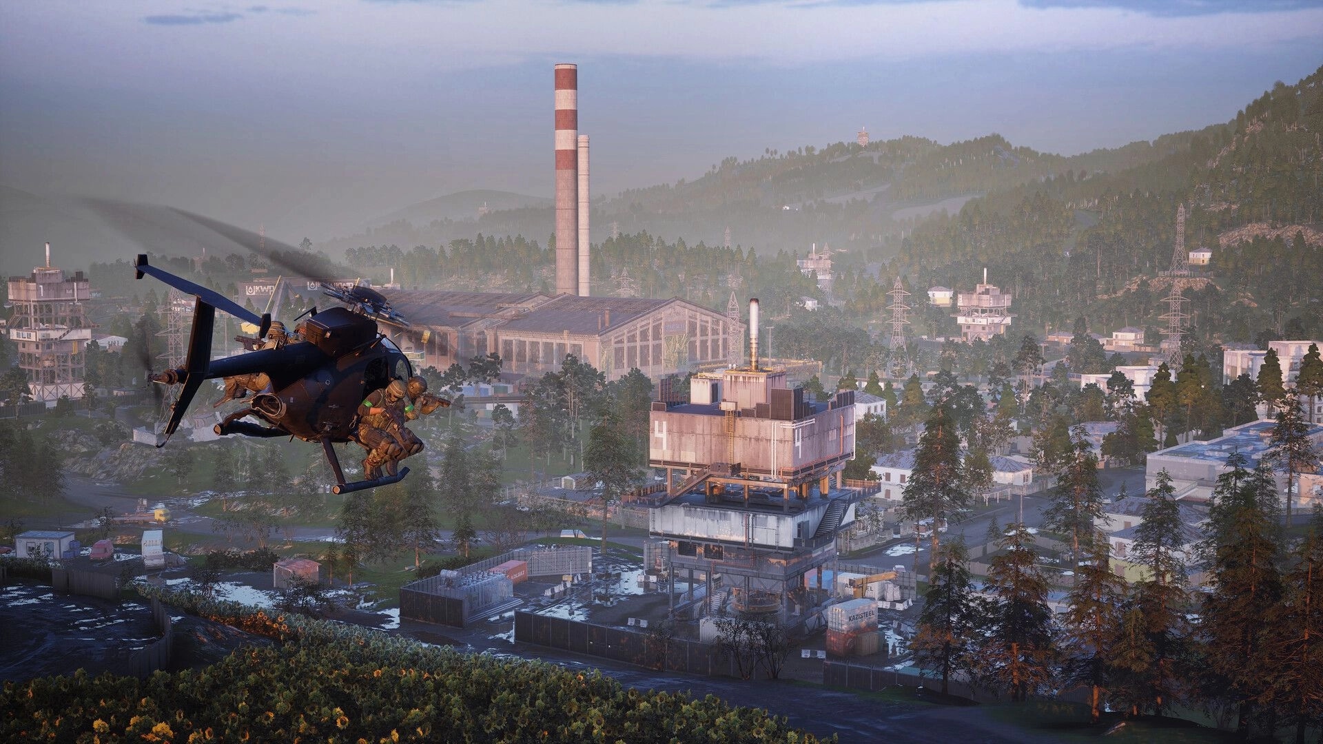 WARDOGS: Helicopter insertion with soldiers rappelling over a sprawling industrial mountain complex.