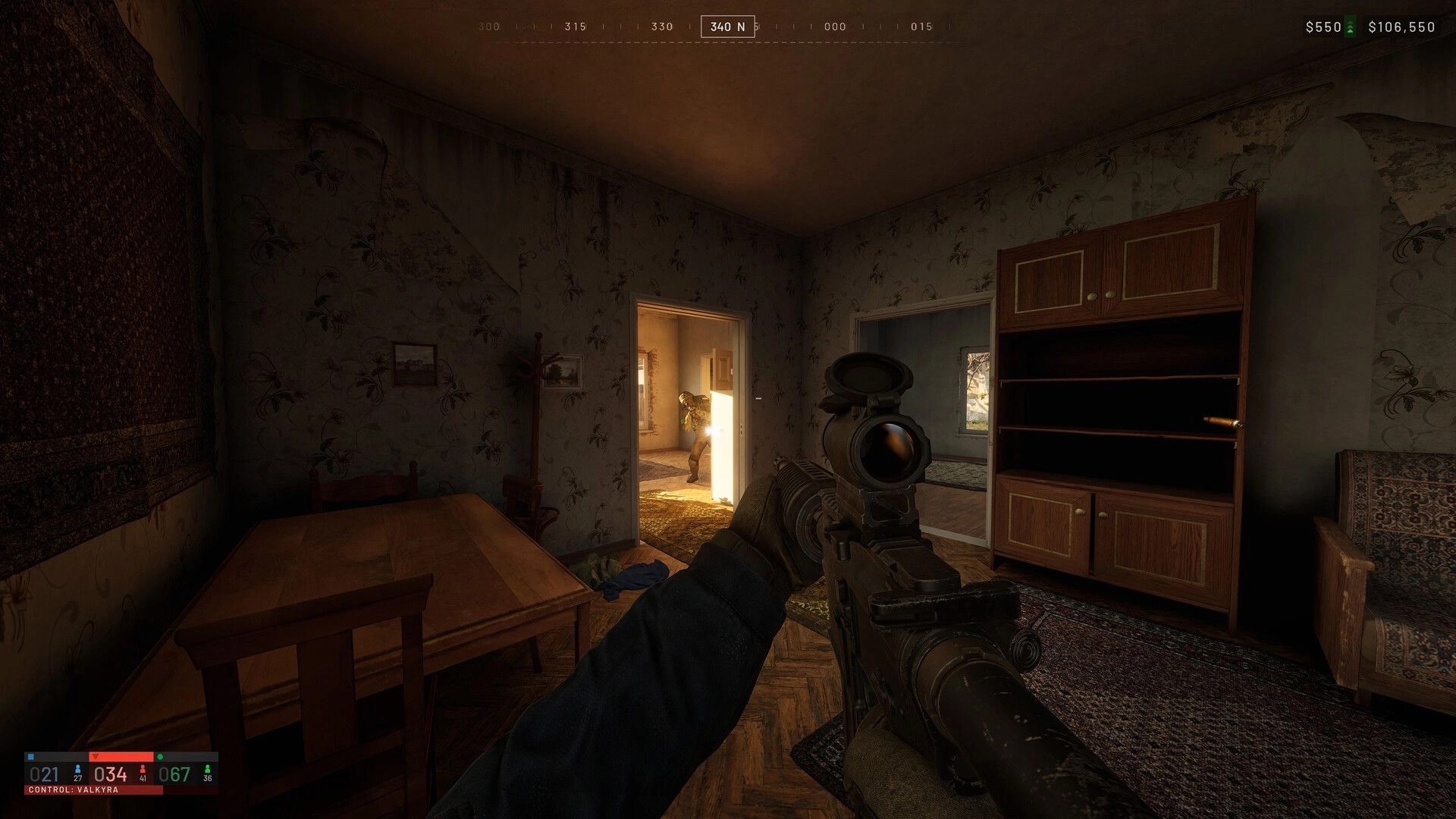 WARDOGS: Scoped rifle aimed at enemy in doorway, HUD cash and compass inside dim apartment room.