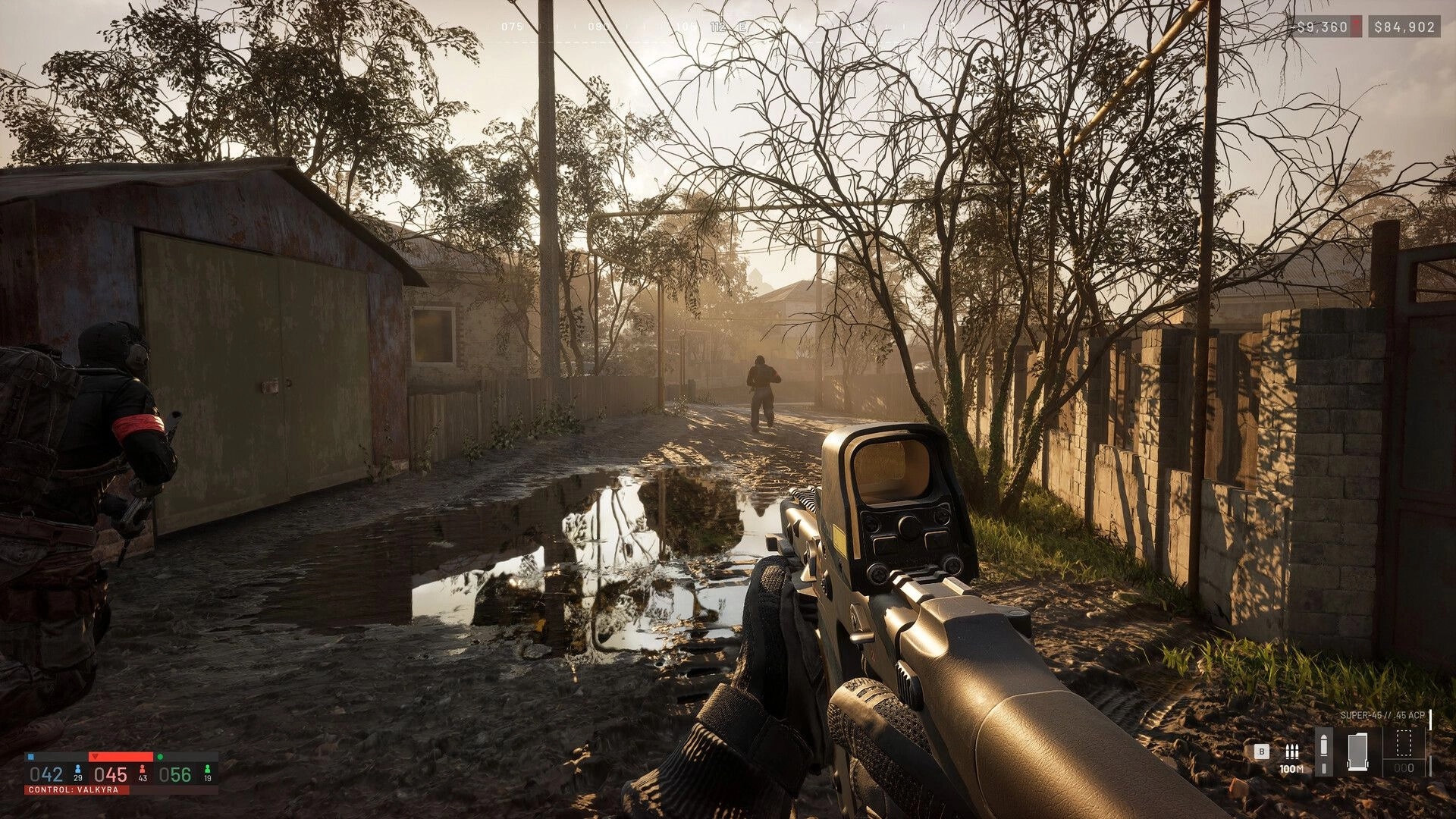 WARDOGS: First-person rifle aiming down a muddy lane with teammates ahead in a foggy village street.