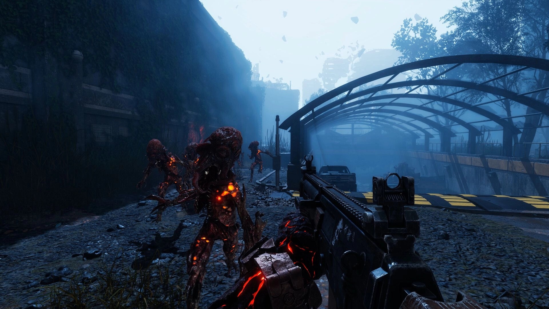 Waste The Fallen: First-person rifle aimed at glowing mutants in a foggy ruined tunnel roadway.