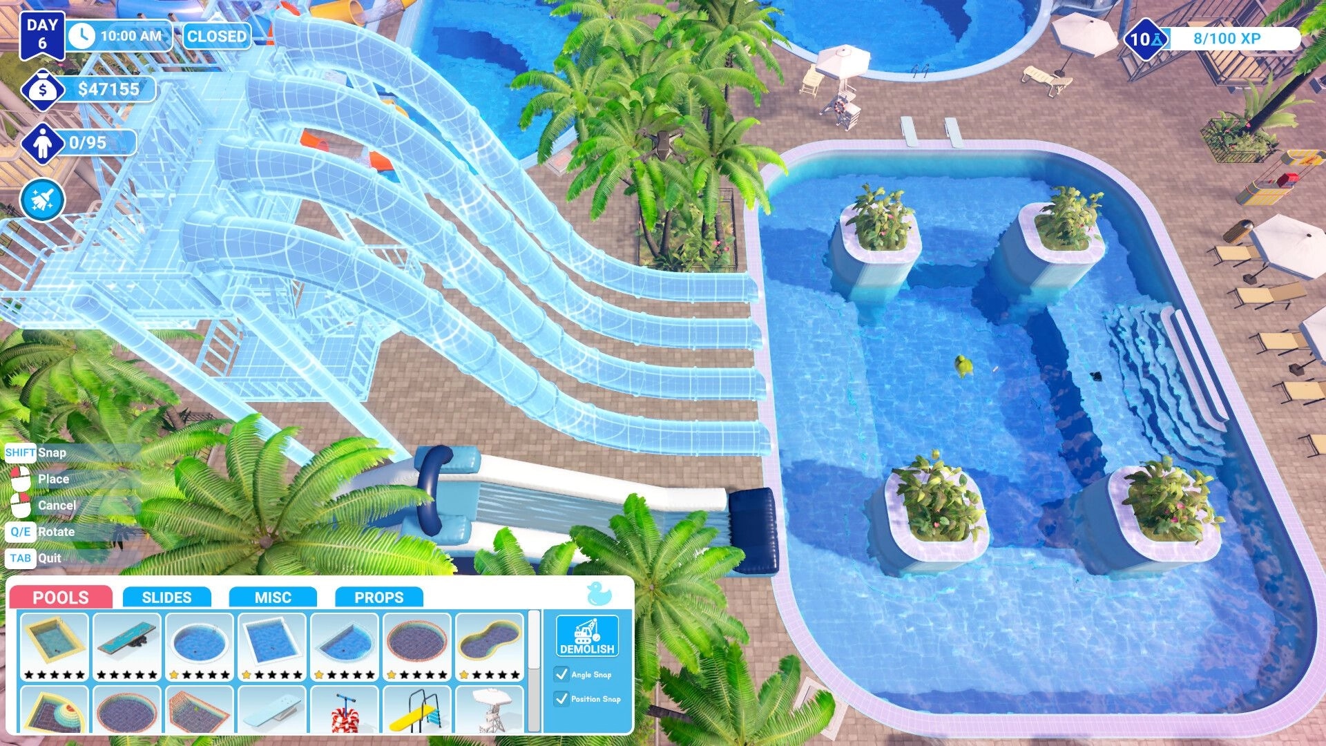 Waterpark Simulator: Designing water slides next to a pool with interface showing building options