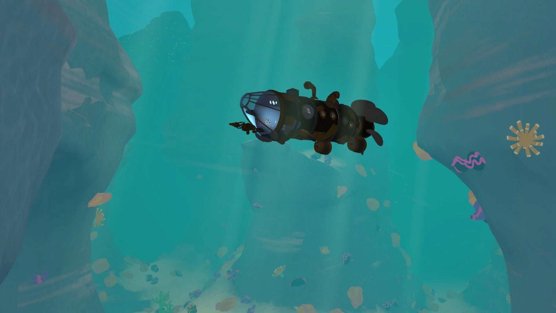 What’Sub: Submarine cruising through a deep ocean canyon with coral and sunbeams in blue water.