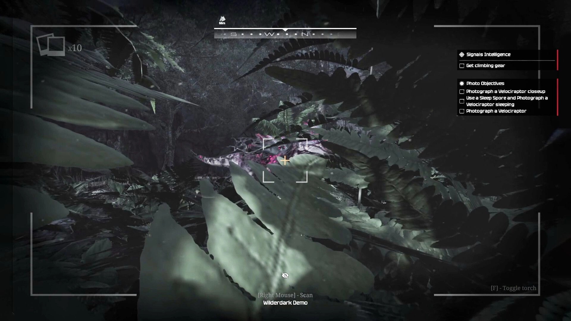 Wilderdark: Camera scan aimed at a hidden velociraptor in dense jungle foliage with objectives UI list.