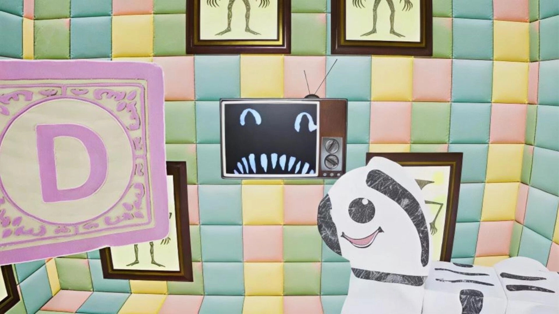 Wonderland: Cartoon ghost figure and eerie TV face in pastel padded room with skeletal drawings