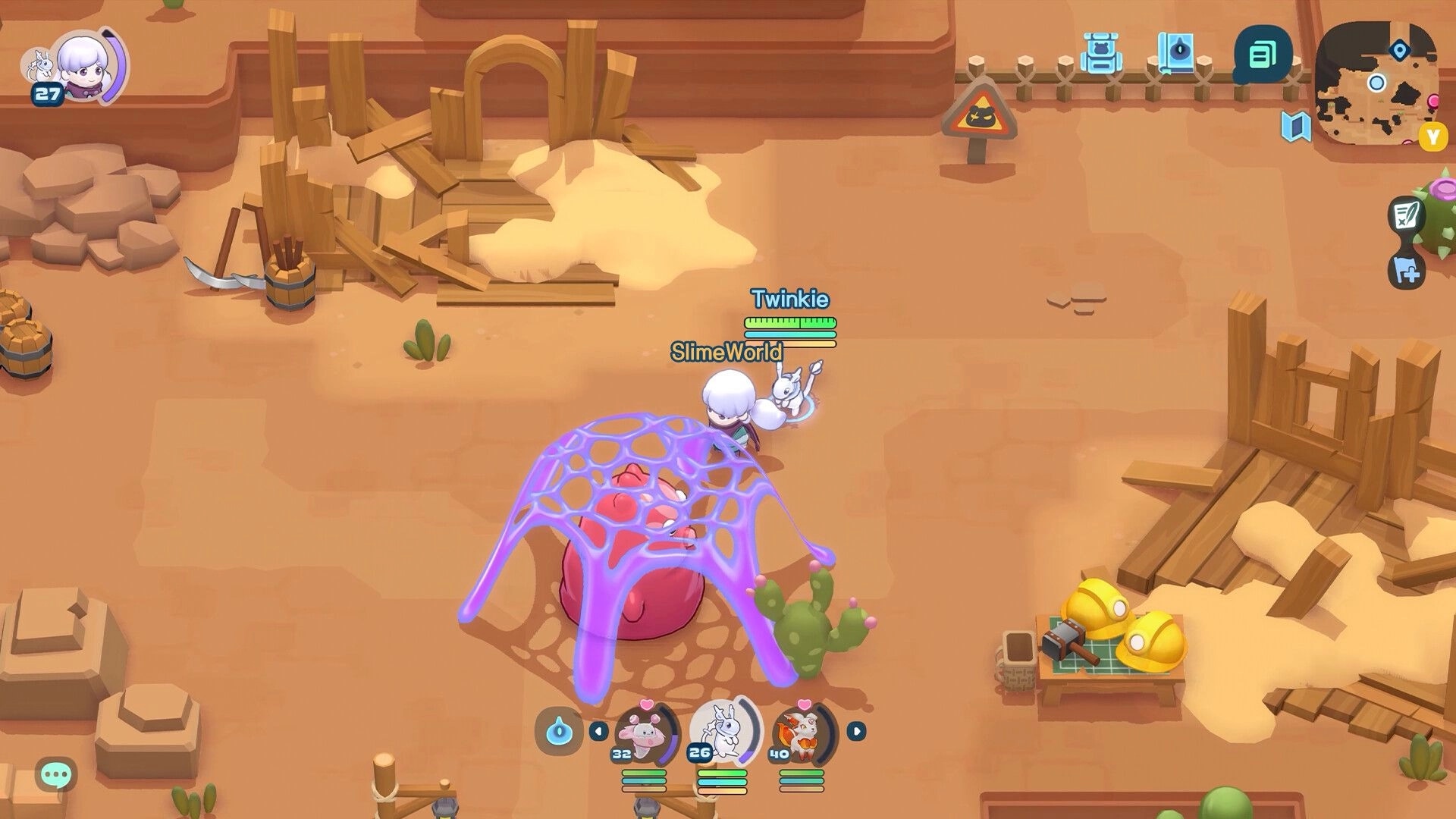 World of Slime: Twinkie traps a pink slime under a purple net in a sandy canyon with debris UI.
