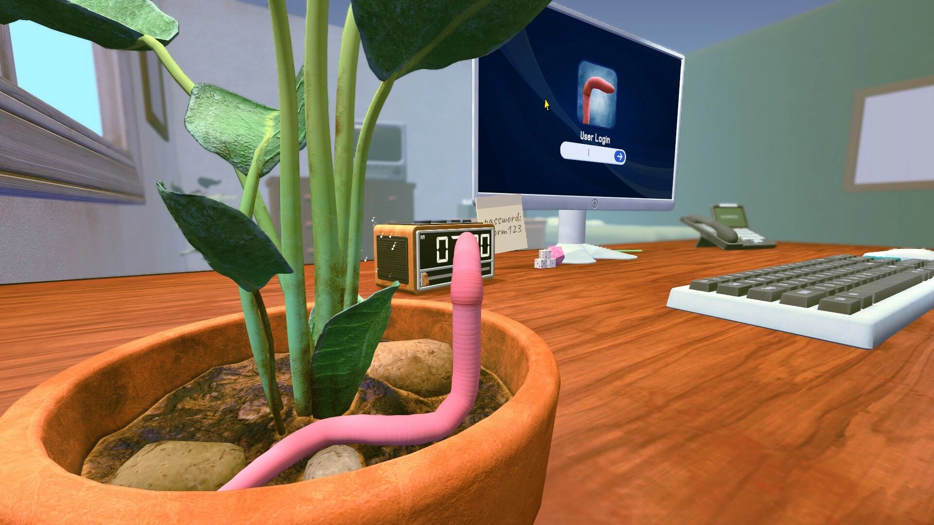 Worming from Home: Pink worm in plant pot on desk with computer showing user login screen