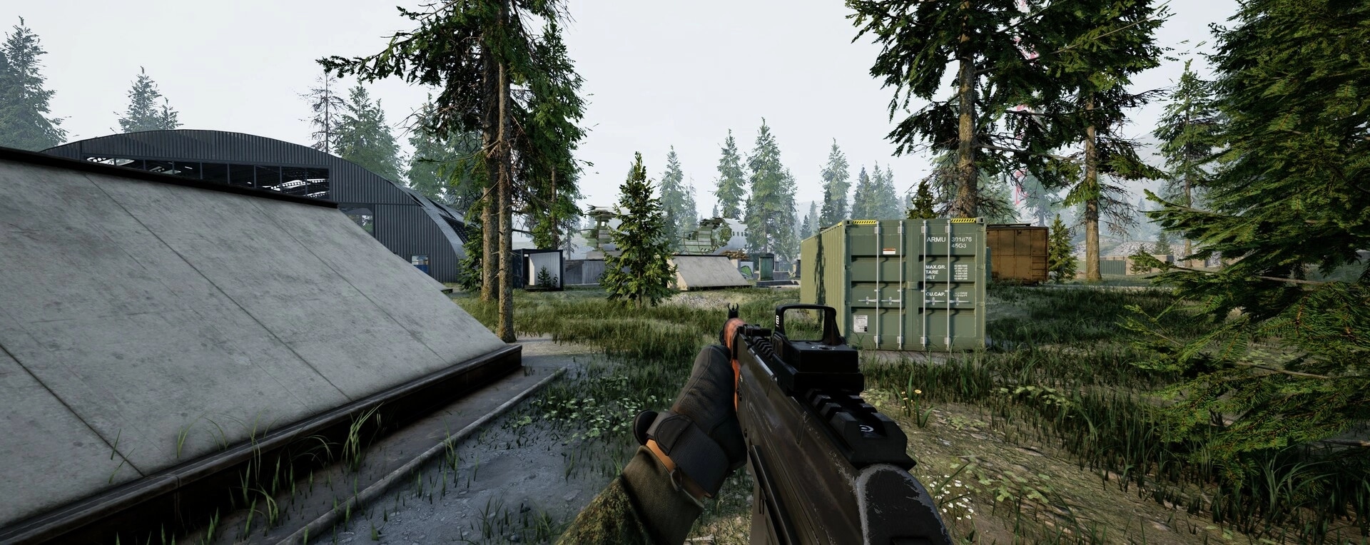 WRAITH OPS: Player aiming rifle in forested military base with containers and structures visible