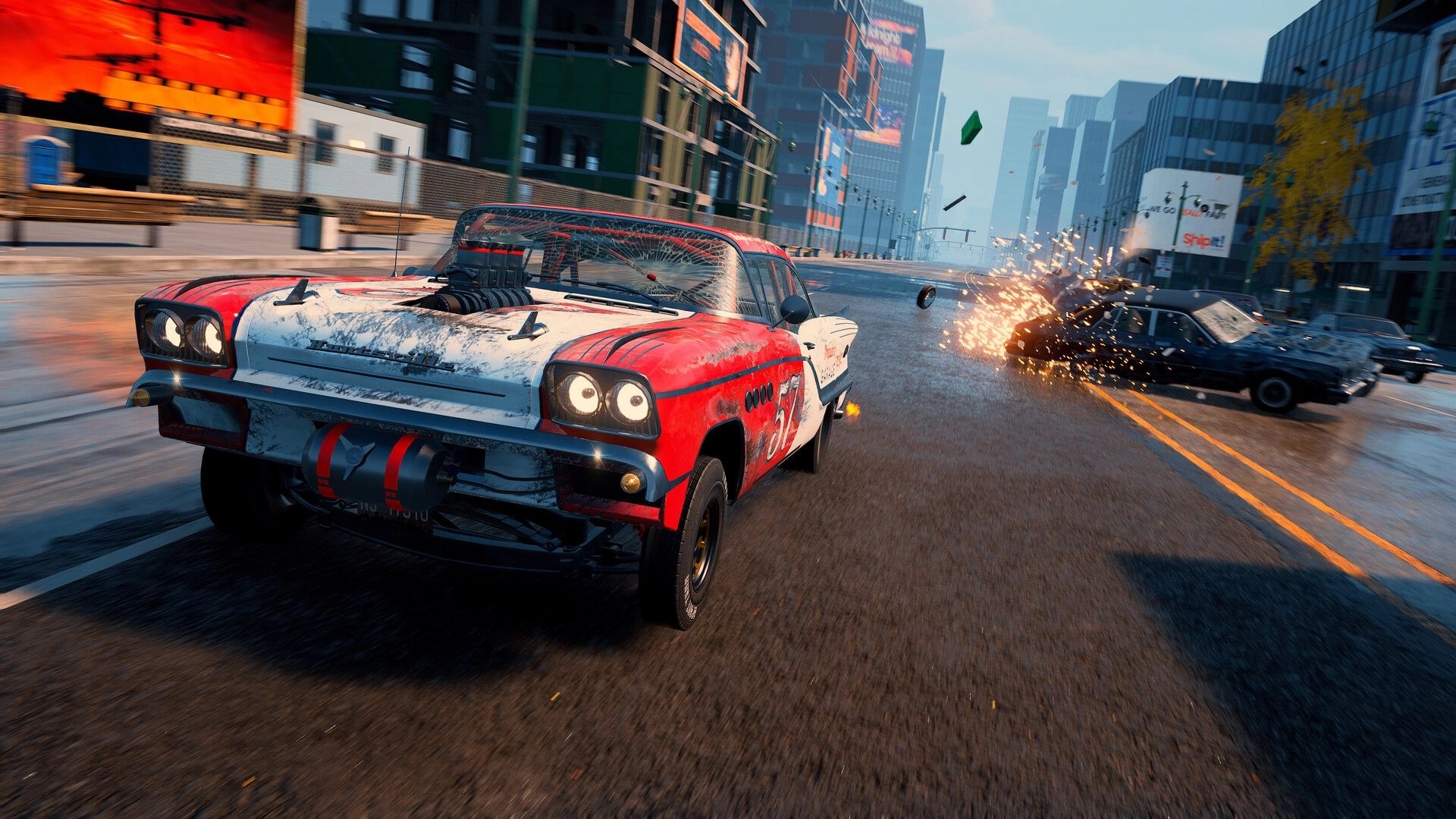 Wreckreation 2: Red muscle car races past a sparking crash on a wide downtown city street.
