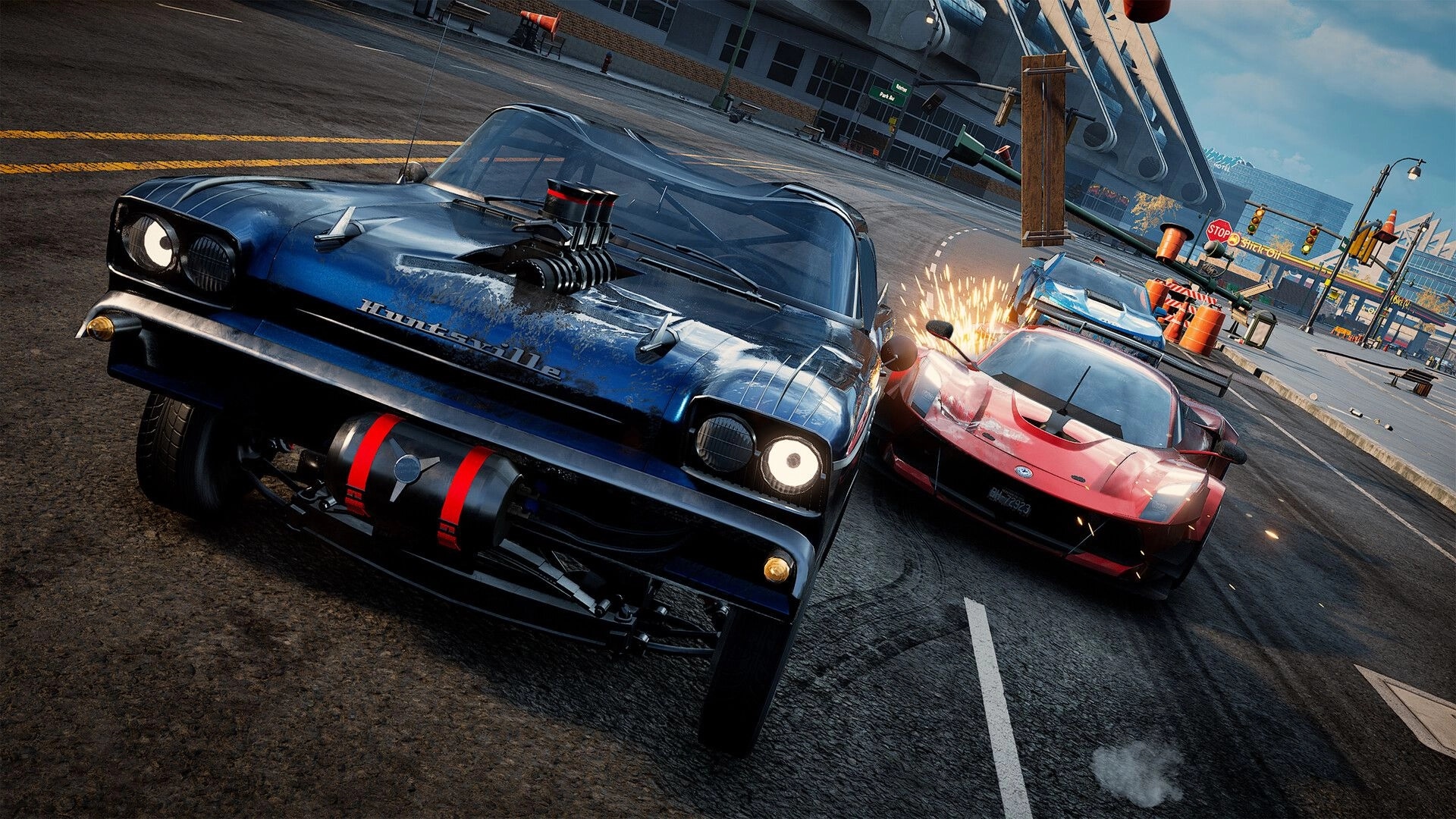 Wreckreation 2: Blue muscle car sideswipes a red supercar, sparks flying on a city street corner.