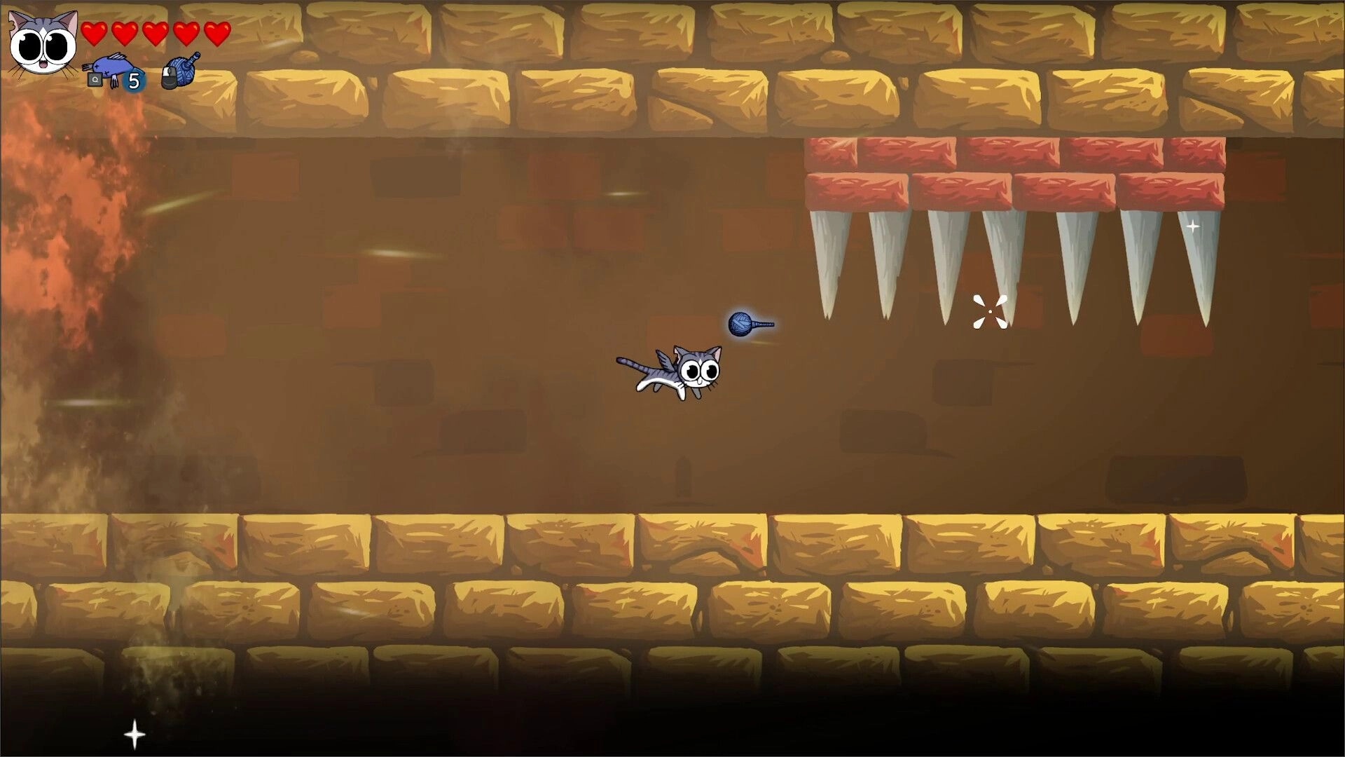 Yarn Guardians: Flying cat dodges spikes in a dungeon with health and yarn ball count in top corner