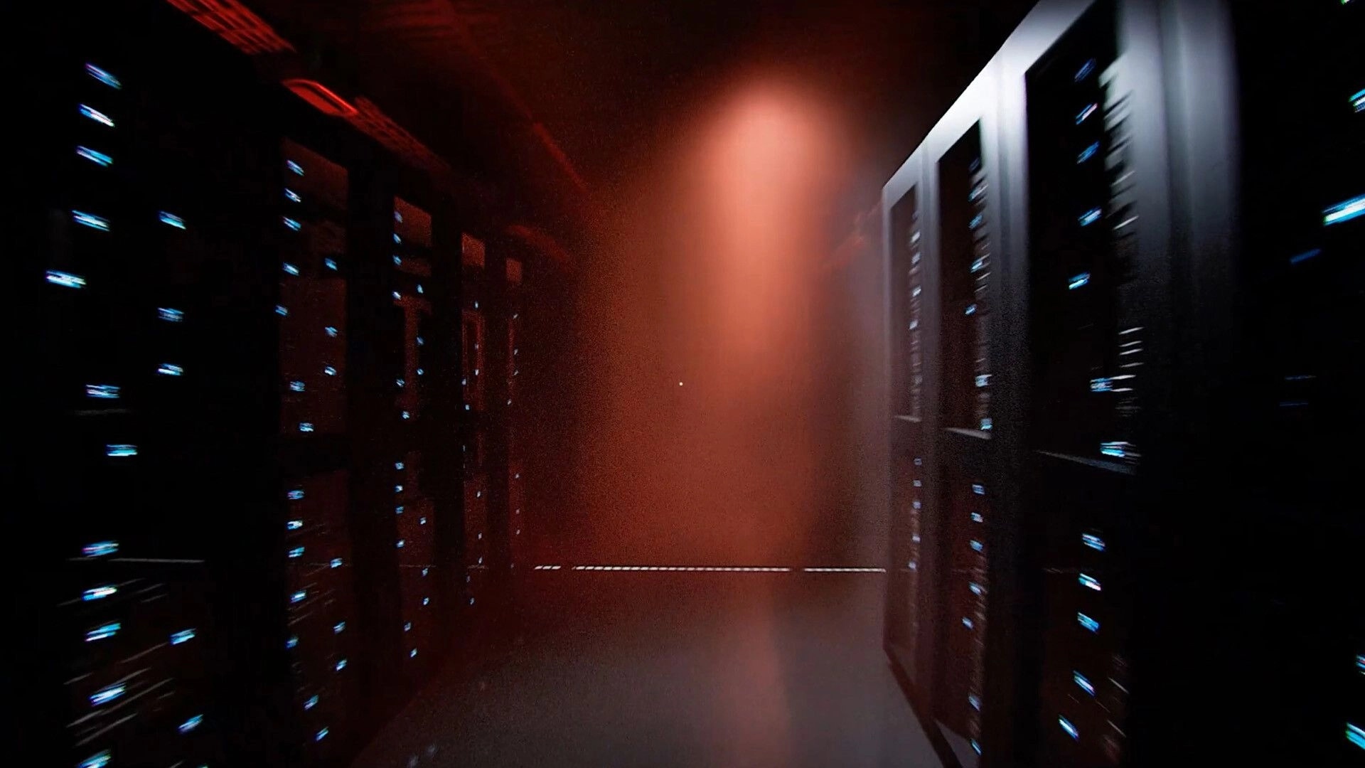 Zangyou: First-person view down a red-lit server corridor with blinking rack lights and haze ahead.