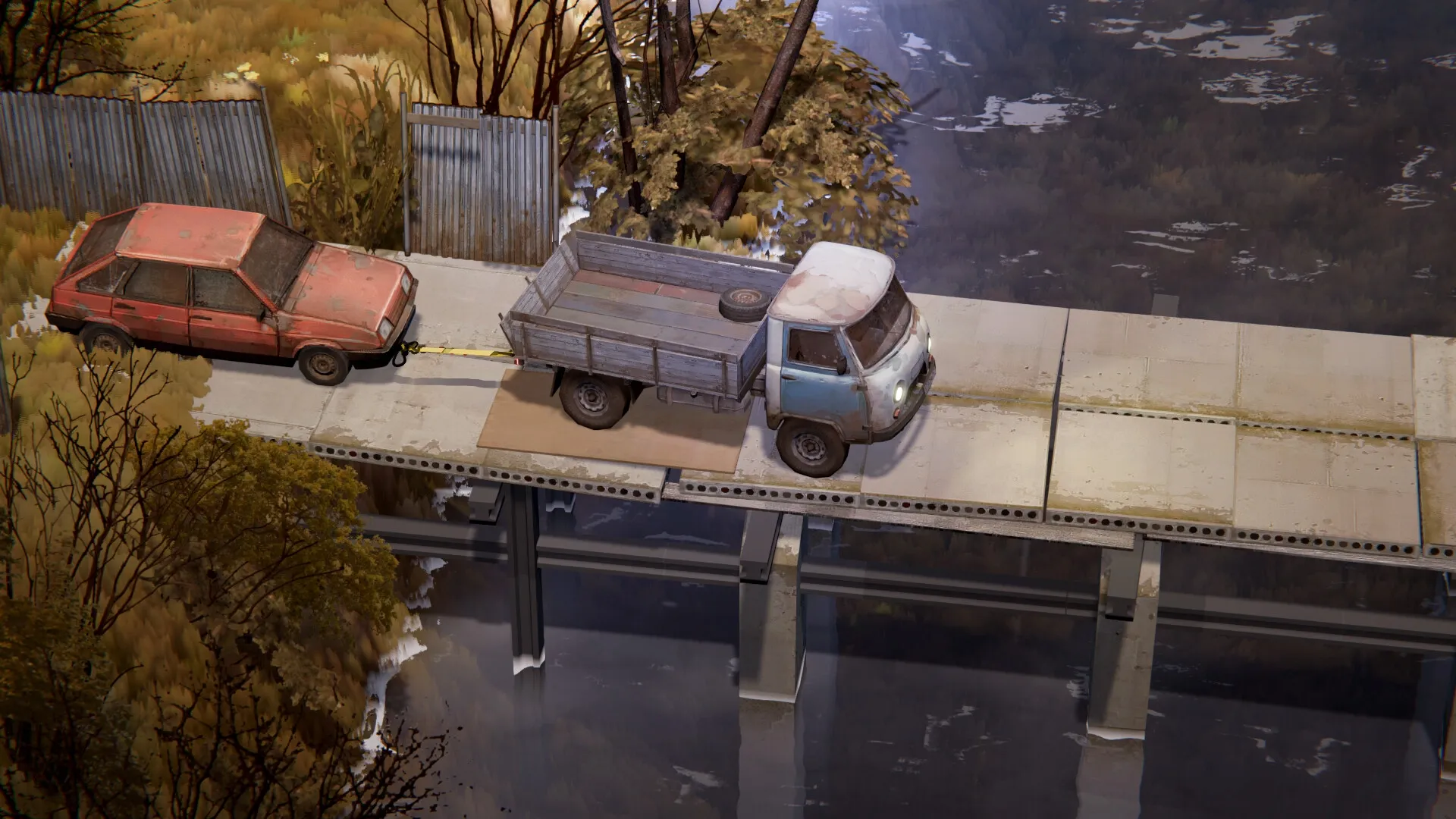 Zarya: Two vehicles on a rural bridge, with an old truck towing a red car through a scenic landscape.