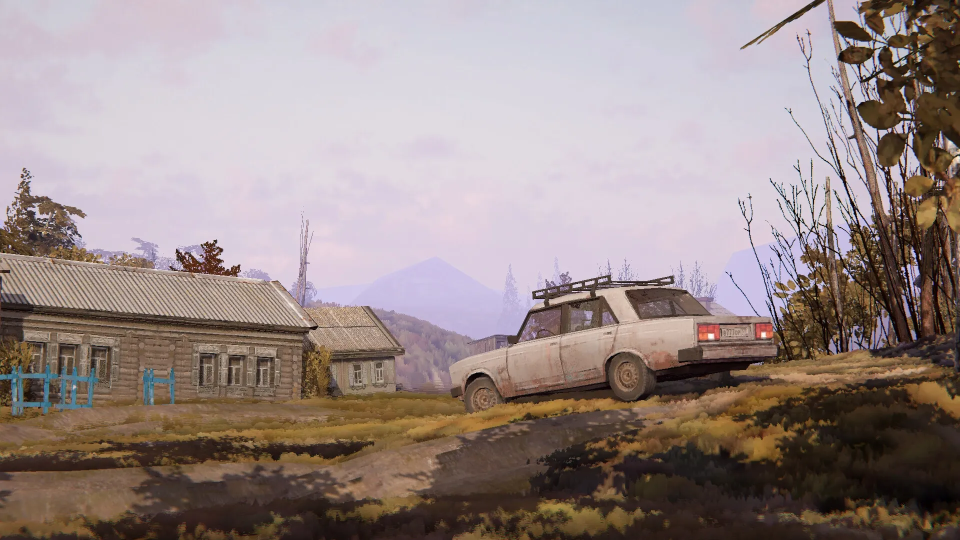 Zarya: Classic car driving on a rural dirt road past wooden houses in a post-Soviet village setting.