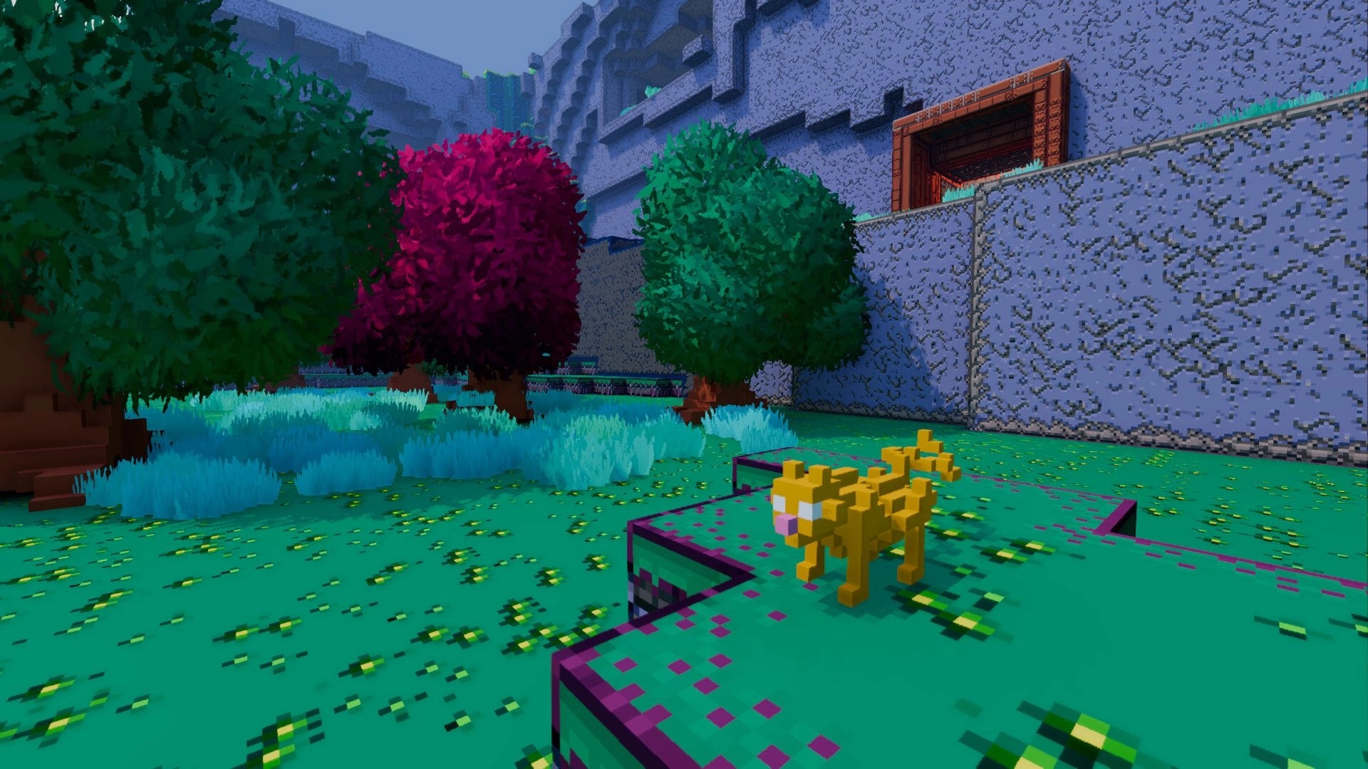 Zebulon 3D: Yellow voxel cat on grassy ledge in walled garden with colorful trees and doorway.