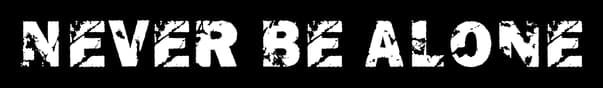 Never Be Alone: Bold distressed stencil lettering with heavy grunge texture and cracks.